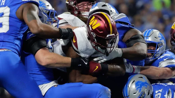 Brian Robinson und die Washington Commanders fanden fast immer einen Weg durch die Abwehr der Lions. - © Rey Del Rio/AP/dpa