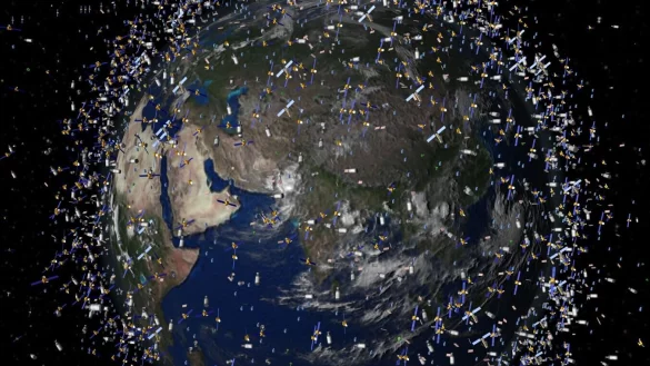 Das computergenerierte Bild zeigt Weltraumm&uuml;ll fr&uuml;herer Weltraummissionen, der neben intakten Satelliten um die Erde kreist. - &copy; ESA/ESA/dpa