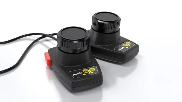 Mit Drehrad, etwa f&uuml;r Sportspiele: Als Zubeh&ouml;r ist der Paddle-Controller CX30+ im Zweierpack erh&auml;ltlich (35 Euro). - &copy; Atari/dpa-tmn