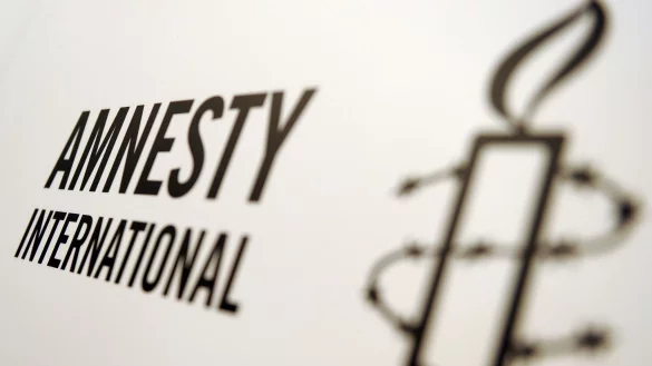Das Logo von Amnesty International. - &copy; Britta Pedersen/dpa-Zentralbild/dpa