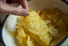 Kartoffelchips - Daniel Karmann/dpa