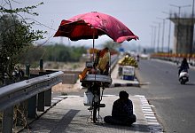 Schutz vor der Hitze - Foto: Channi Anand/AP/dpa