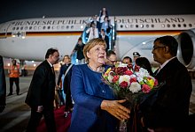 Merkel in Indien - Foto: Michael Kappeler/dpa