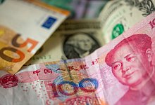 Chinesische Yuan, US-Dollar und Euro - Fernando Gutierrez-Juarez/dpa