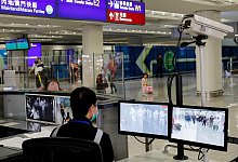 Vorsichtsma&szlig;nahmen - Foto: Andy Wong/AP/dpa