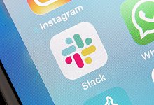 Die Slack-App auf einem Smartphone - Zacharie Scheurer/dpa-tmn