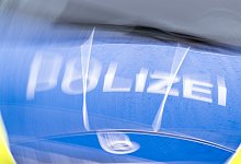 Illustration - Polizeiwagen - Soeren Stache/dpa