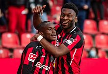 Gl&auml;nzt in der R&uuml;ckrunde als Torj&auml;ger: Leverkusens Moussa Diaby (l). - Marius Becker/dpa