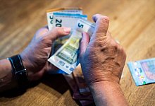 Geld - Lino Mirgeler/dpa/Illustration