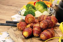 F&uuml;r das Fondue: Speck-Kartoffeln - Foto: KMG/Die-Kartoffel.De/dpa-tmn