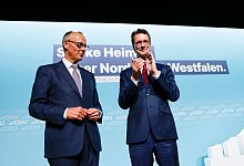 Merz und Wüst stellen Kommunen Finanzspritzen in Aussicht - Thomas Banneyer/dpa