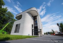 Außenfassade des ersten 3D Druckhauses - Guido Kirchner/dpa/dpa-tmn