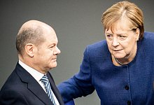 Olaf Scholz und Angela Merkel - Foto: Michael Kappeler/dpa