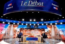 Emmanuel Macron und Marine Le Pen vor der TV-Debatte. - Ludovic Marin/Pool AFP/AP/dpa
