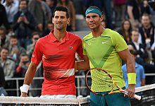 Novak Djokovic (l) und Rafael Nadal - Anne-Christine Poujoulat/AFP/dpa