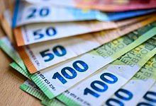 Geld - Hendrik Schmidt/dpa