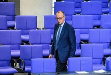 Deutschlands «sehr großes» soziale Netz zieht Flüchtlinge und Migranten «aus vielen Ländern» nach Meinung von CDU-Chef Friedrich Merz «erst richtig an». - Bernd von Jutrczenka/dpa