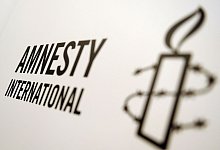 Logo von Amnesty International - Britta Pedersen/dpa-Zentralbild/dpa