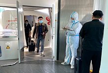 Einreise in China - Foto: Ng Han Guan/AP/dpa