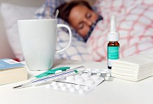 Grippe-Patientin im Bett - Foto: Maurizio Gambarini