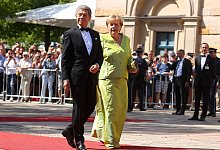 Joachim Sauer und Angela Merkel - Karl-Josef Hildenbrand/dpa/dpa-tmn