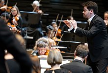 Dirigent Lahav Shani und die Münchner Philharmoniker - Sven Hoppe/dpa