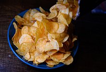 Kartoffelchips - Robert Michael/dpa