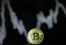 Bitcoin - Foto: Ina Fassbender/dpa/dpa-tmn/Archiv