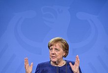 Merkel - Foto: John Macdougall/AFP Pool/dpa