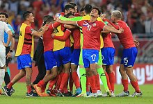 Die Spieler von Costa Rica feiern den Einzug in die WM-Endrunde. - Hussein Sayed/AP/dpa