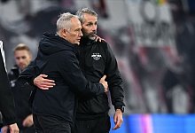 Streich und Rose - Hendrik Schmidt/dpa