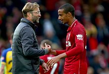 Joel Matip und J&uuml;rgen Klopp - Dave Thompson/PA Wire/dpa