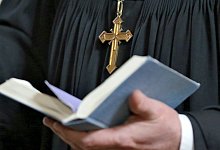 Kreuz und Bibel - Foto: Jan Woitas/dpa-Zentralbild/dpa