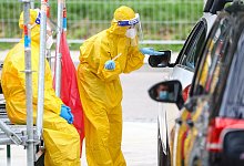 Corona-Teststation - Foto: Christoph Schmidt/dpa