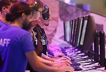 Gamer bei der Gamescom - Oliver Berg/dpa