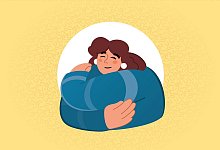 Eine Frau umarmt sich selbst - dpa-Infografik Gmbh/dpa-tmn