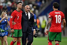 Cristiano Ronaldo (l.) - Arne Dedert/dpa