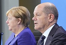 Bundeskanzler Olaf Scholz ist sich in vielen Angelegenheiten mit seiner Vorg&auml;ngerin einig. - Michael Kappeler/dpa POOL/dpa