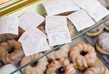 Kassenzettel am Verkaufstresen - Foto: Jan Woitas/dpa-Zentralbild/dpa-tmn