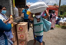 Coronavirus trifft Menschen in Armut besonders hart - Foto: Moises Castillo/AP/dpa