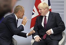 Tusk und Johnson - Foto: Markus Schreiber/AP