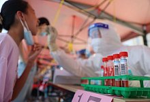 Corona-Abstrich in China - Foto: Zeng Demeng/XinHua/dpa