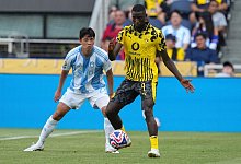 Serhou Guirassy (r) im Schwarz-Gelben Puma-Trikot. - Jeff Dean/FR171800 AP/AP/dpa