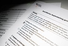 Asylantrag - Julian Stratenschulte/dpa