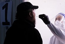 Corona-Neuinfektionen - Foto: Julian Stratenschulte/dpa