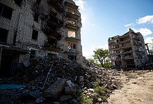 Zerstörte Gebäude stehen in der Stadt Isjum in der Region Charkiw. - Danylo Antoniuk/ZUMA Press Wire/dpa