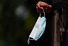 Einwegmaske - Foto: Robert Michael/dpa-Zentralbild/dpa