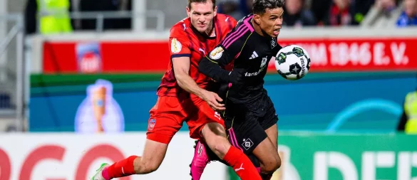 Notbremse: Für dieses Foul sah Heidenheims Tim Siersleben (l.) Rot. - © Tom Weller/dpa