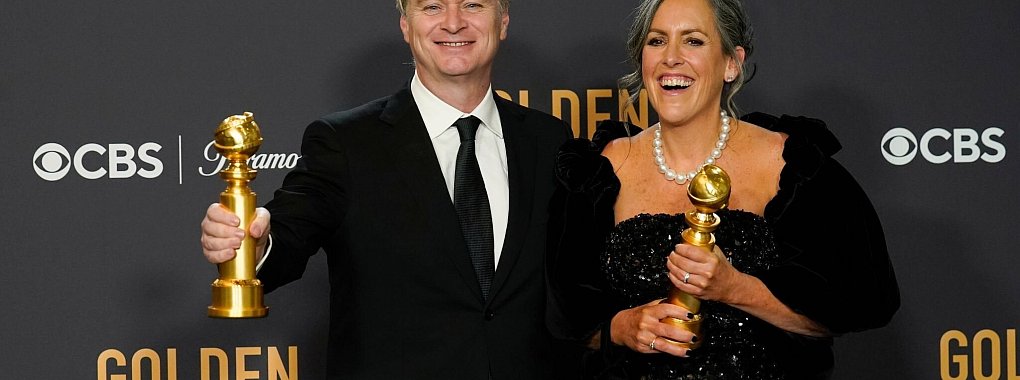 Regisseur Christopher Nolan freut sich mit seiner Frau, der Filmproduzent Emma Thomas, &uuml;ber die Golden Globes. - &copy; Chris Pizzello/Invision/AP/dpa
