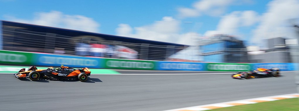 Lando Norris schlägt in Zandvoort den Lokalmatadoren und WM-Spitzenreiter. - © Peter Dejong/AP/dpa